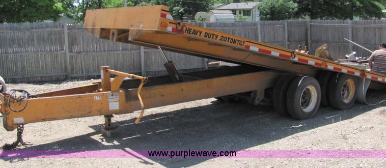 image for item D7995 2003 tandem axle tilt deck trailer