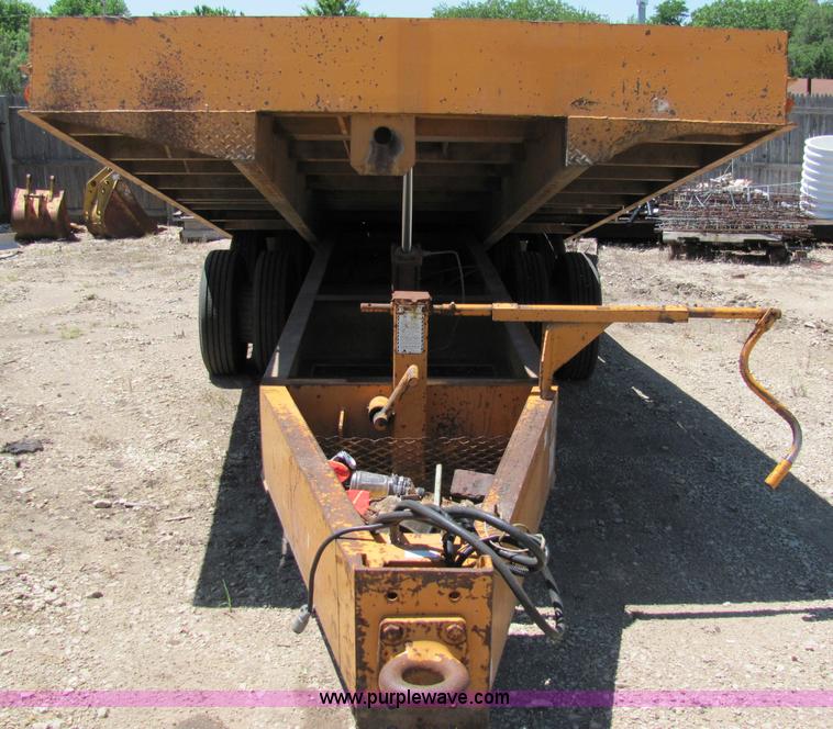 image for item D7995 2003 tandem axle tilt deck trailer