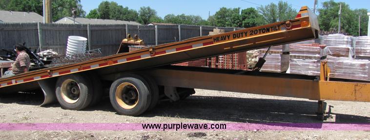 image for item D7995 2003 tandem axle tilt deck trailer