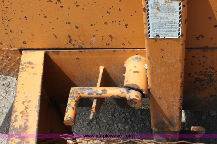 image for item D7995 2003 tandem axle tilt deck trailer