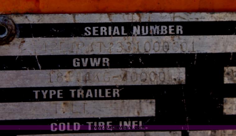 image for item D7995 2003 tandem axle tilt deck trailer