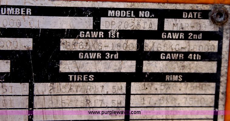 image for item D7995 2003 tandem axle tilt deck trailer