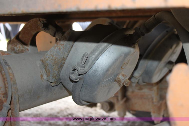 image for item D7995 2003 tandem axle tilt deck trailer