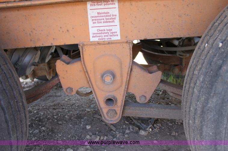 image for item D7995 2003 tandem axle tilt deck trailer