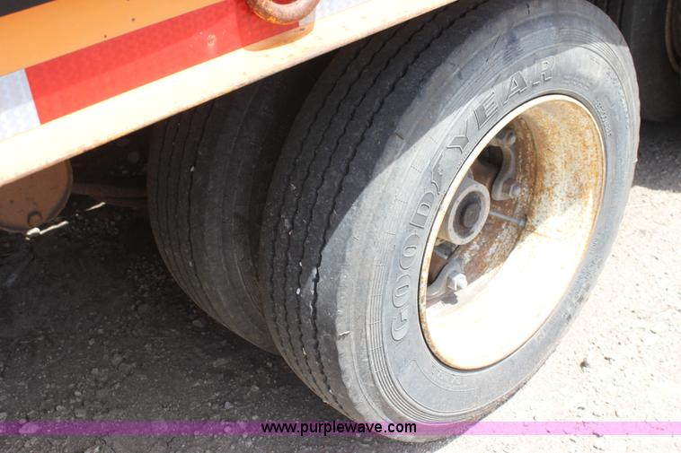 image for item D7995 2003 tandem axle tilt deck trailer