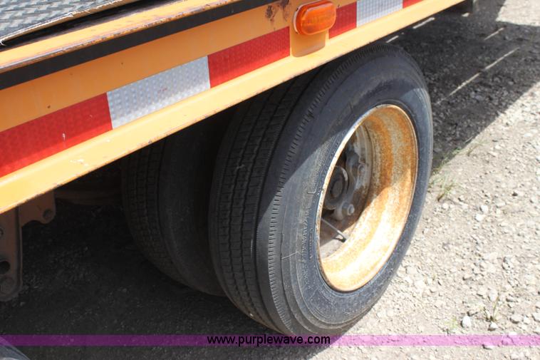 image for item D7995 2003 tandem axle tilt deck trailer