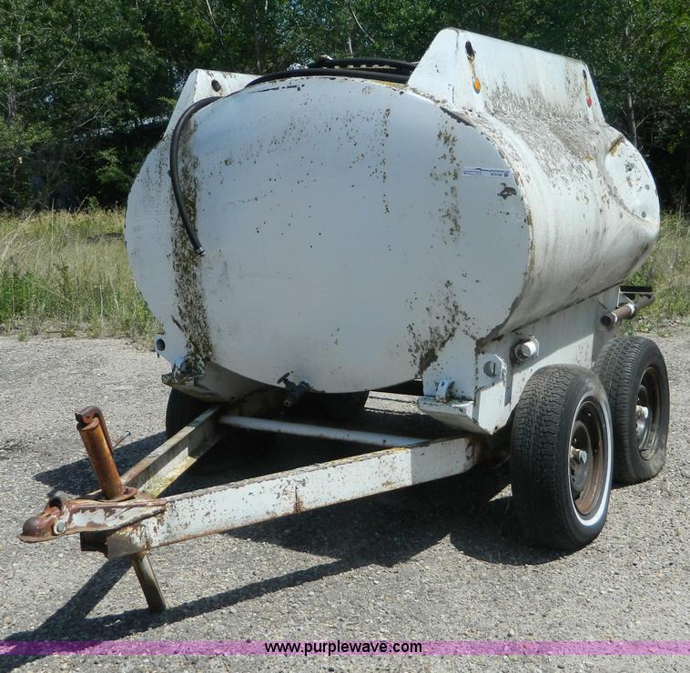 image for item M9780 Portable water tank on four wheel trailer