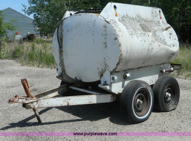 image for item M9780 Portable water tank on four wheel trailer