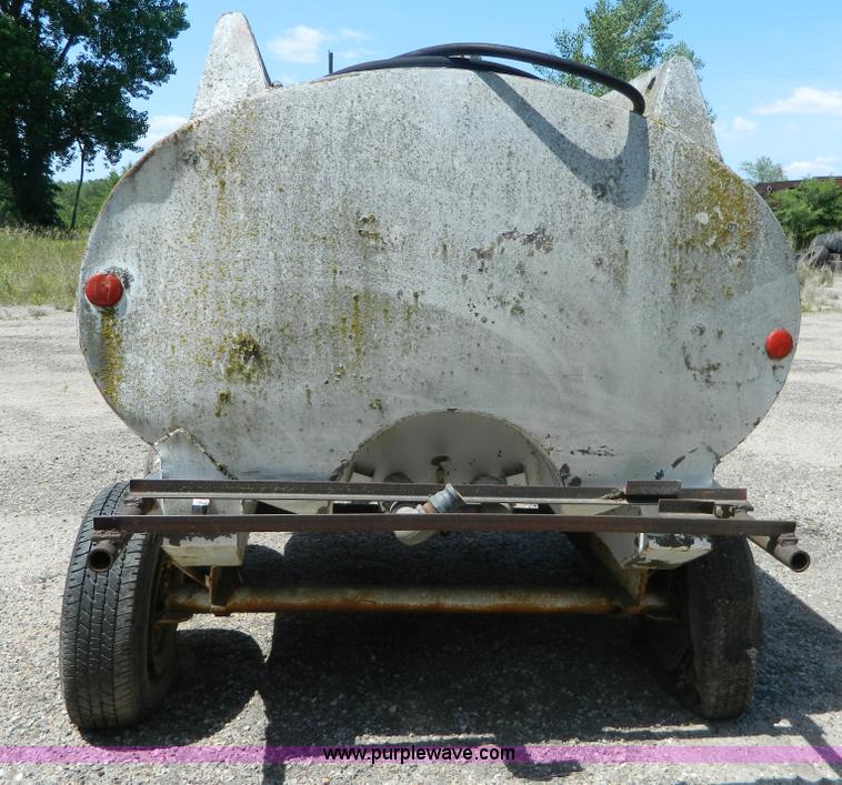 image for item M9780 Portable water tank on four wheel trailer