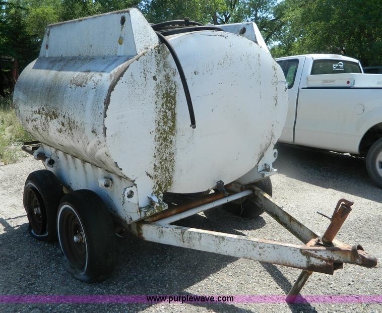 image for item M9780 Portable water tank on four wheel trailer
