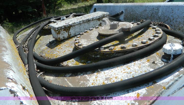 image for item M9780 Portable water tank on four wheel trailer