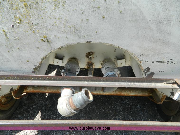 image for item M9780 Portable water tank on four wheel trailer