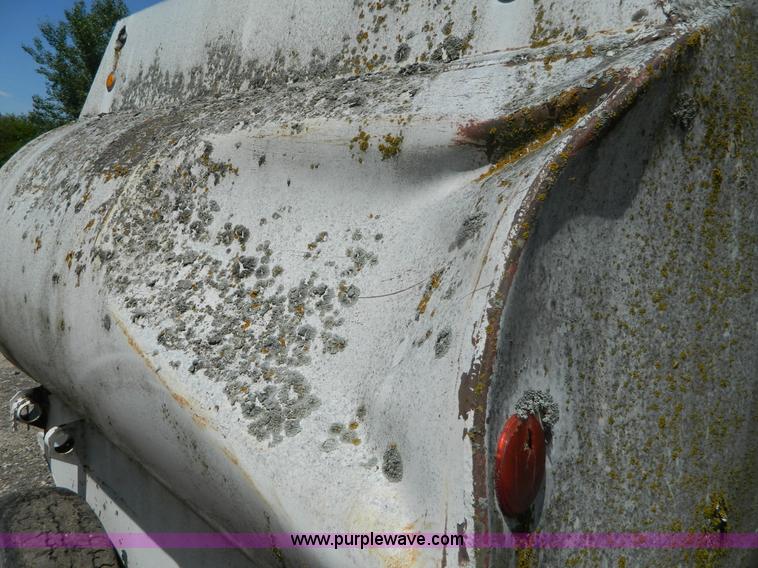 image for item M9780 Portable water tank on four wheel trailer