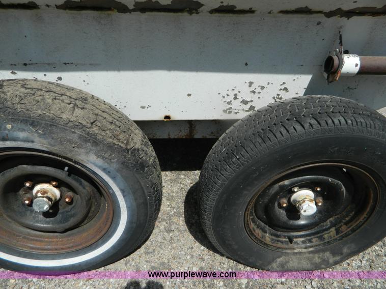 image for item M9780 Portable water tank on four wheel trailer