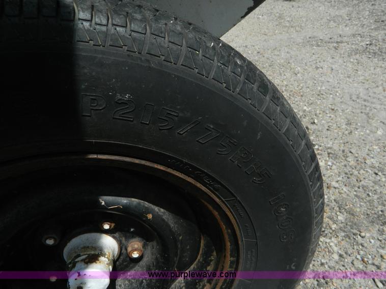 image for item M9780 Portable water tank on four wheel trailer