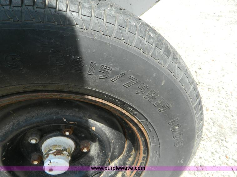 image for item M9780 Portable water tank on four wheel trailer