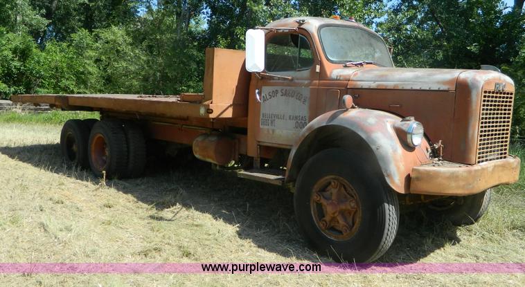 image for item M9804 1961 Gold Comet Reo flatbed truck