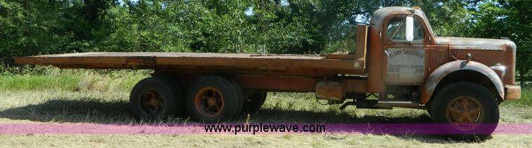 image for item M9804 1961 Gold Comet Reo flatbed truck