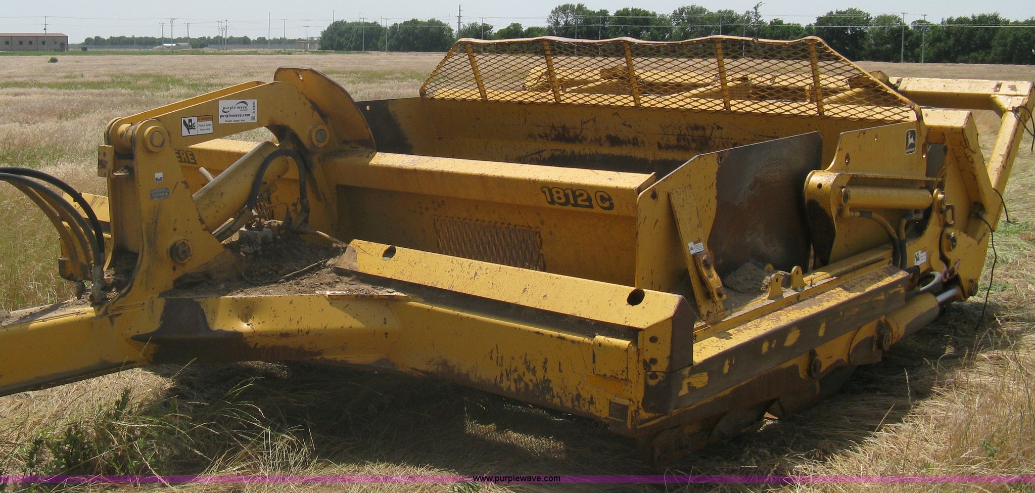 John Deere 1812C scraper pan in Sedgwick, KS Item A6400 sold Purple Wave
