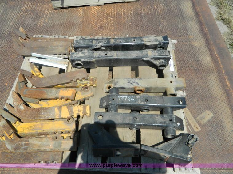 image for item T9916 Assortment of ripper teeth, hardware, and hard-faced rock teeth