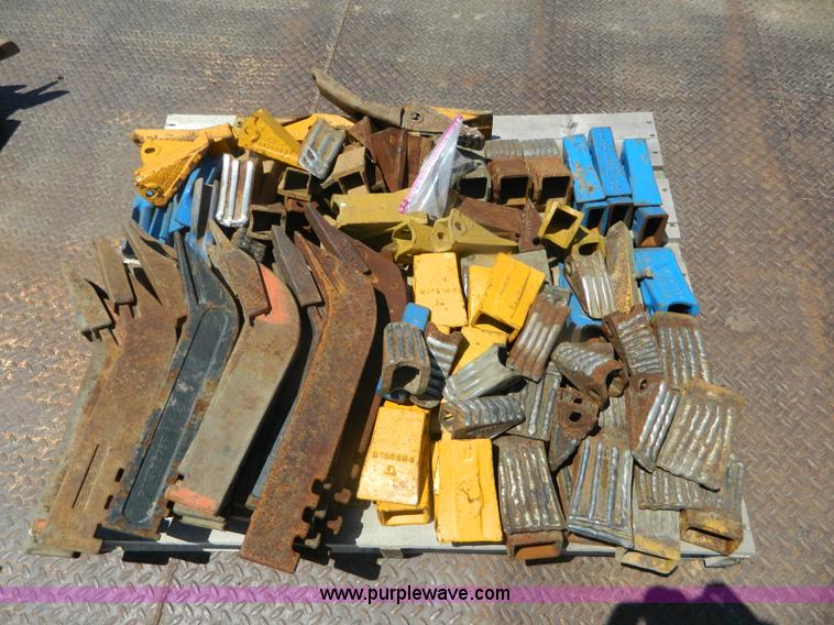 image for item T9916 Assortment of ripper teeth, hardware, and hard-faced rock teeth