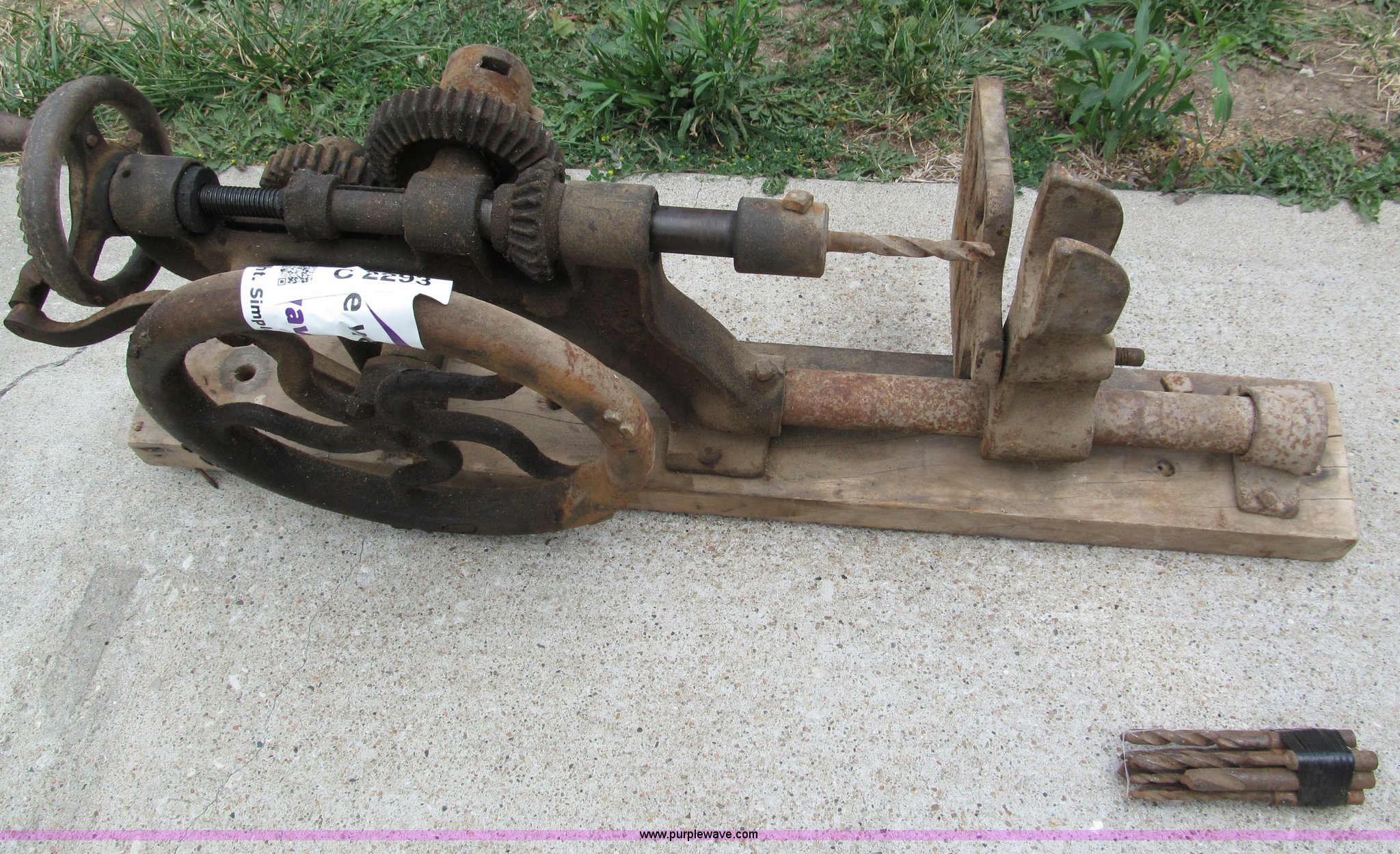 Wall mounted antique drill press with bits in Harrisonville, MO Item