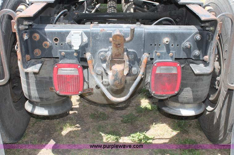 image for item C2556 2000 Freightliner FL70 semi truck