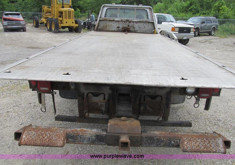 image for item B2744 1995 Ford F450 XLT Super Duty roll back truck