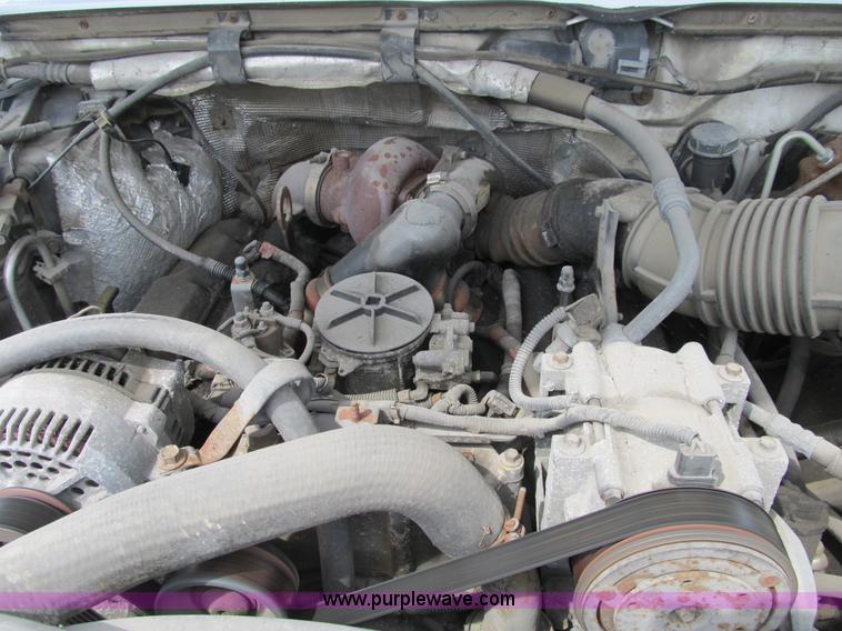 image for item B2744 1995 Ford F450 XLT Super Duty roll back truck