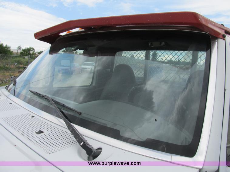 image for item B2744 1995 Ford F450 XLT Super Duty roll back truck