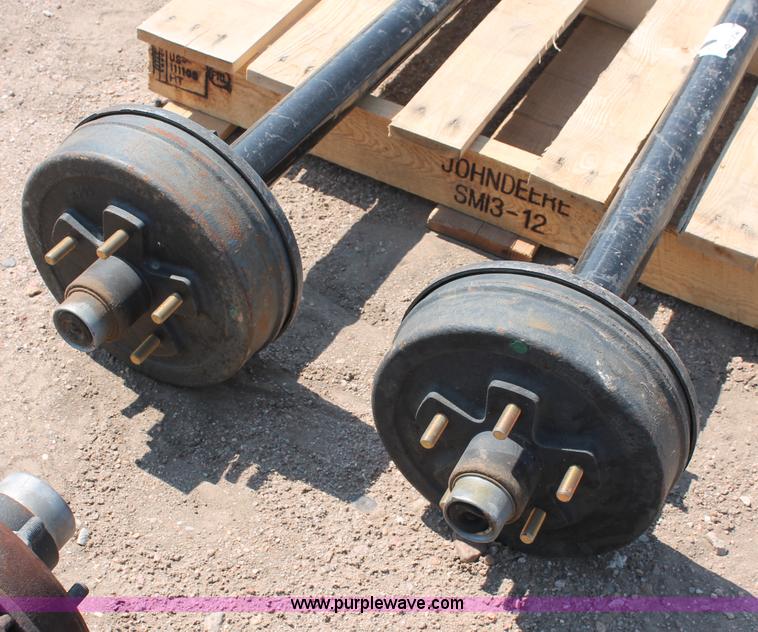 image for item L9922 (2) Rockwell American 3,500 lbs trailer axles with brakes