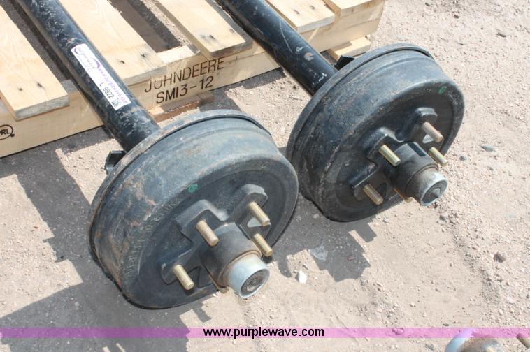 image for item L9922 (2) Rockwell American 3,500 lbs trailer axles with brakes