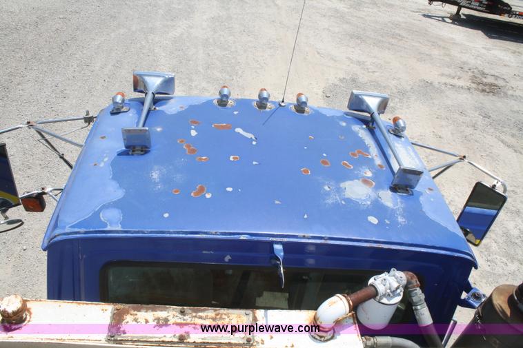 image for item B6677 1991 Ford L9000 AeroMax semi truck with basic fabrication and equipment mud system