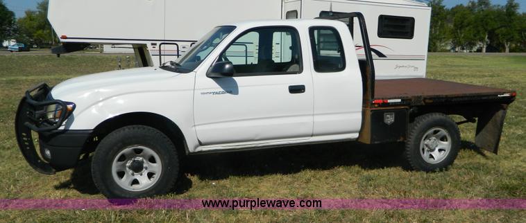image for item B3806 2001 Toyota Tacoma flatbed pickup truck