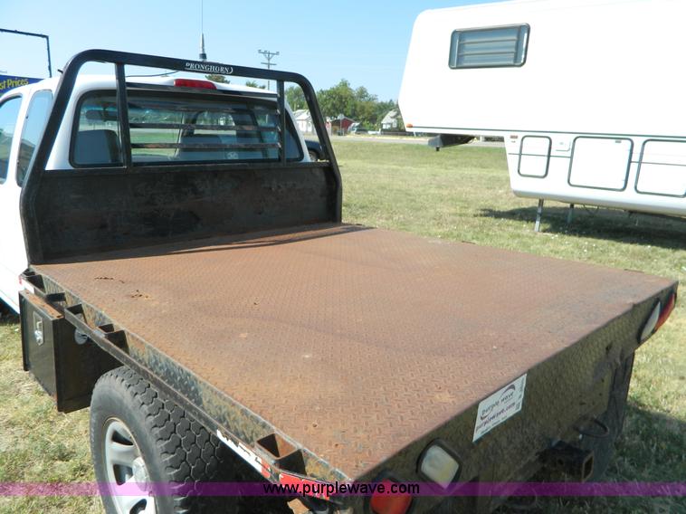 image for item B3806 2001 Toyota Tacoma flatbed pickup truck