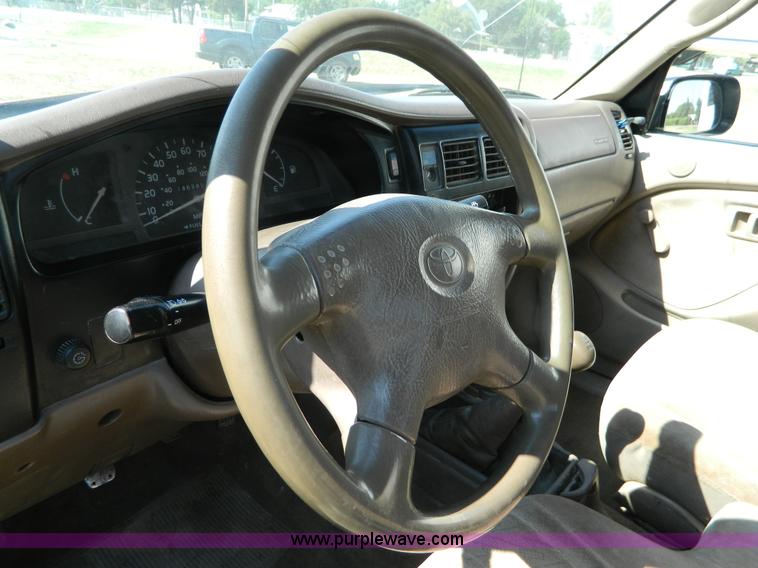 image for item B3806 2001 Toyota Tacoma flatbed pickup truck