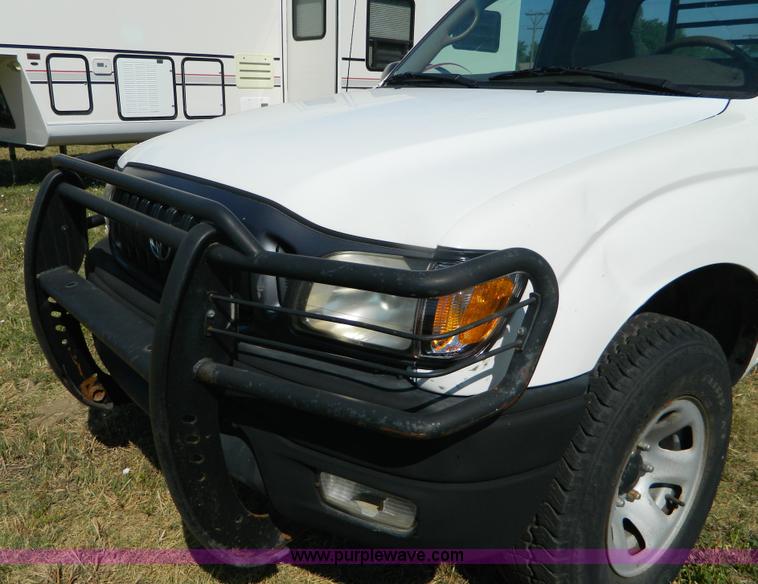 image for item B3806 2001 Toyota Tacoma flatbed pickup truck