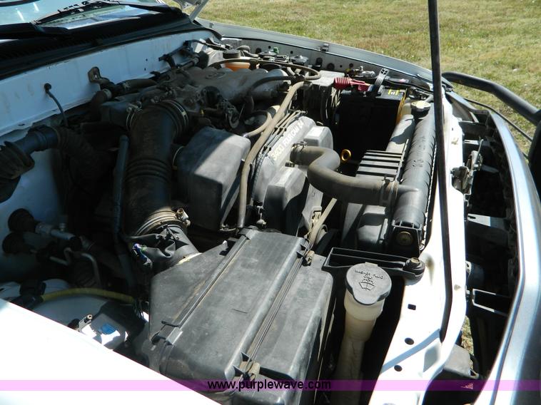 image for item B3806 2001 Toyota Tacoma flatbed pickup truck