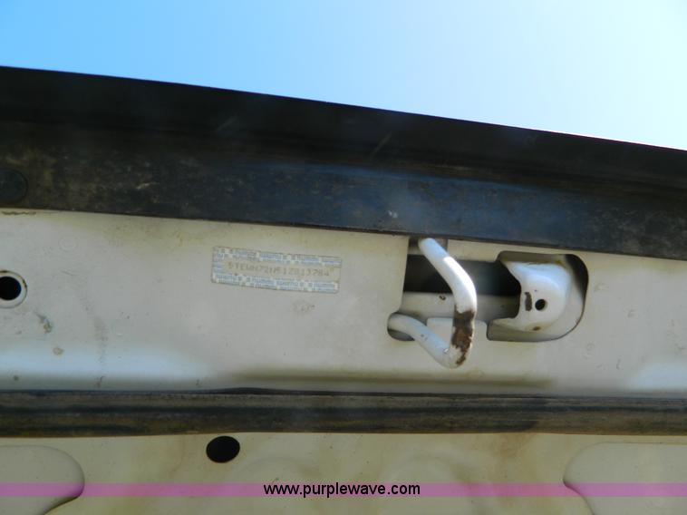 image for item B3806 2001 Toyota Tacoma flatbed pickup truck