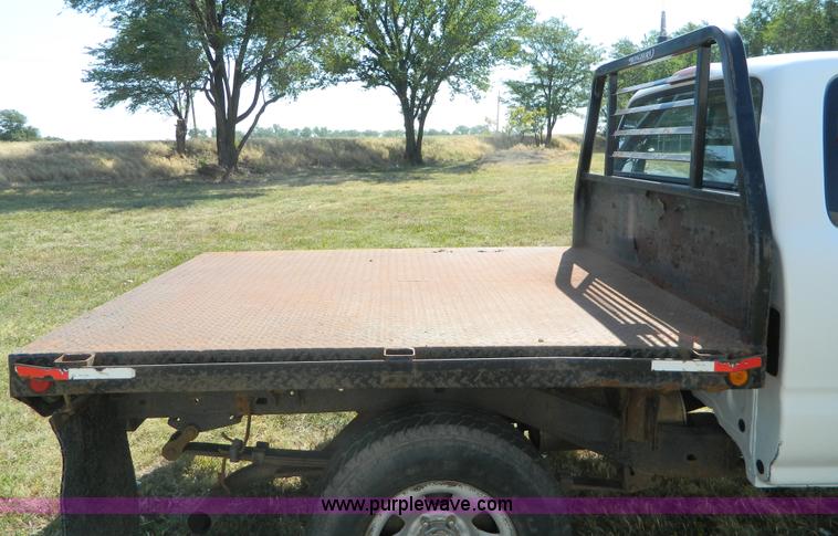 image for item B3806 2001 Toyota Tacoma flatbed pickup truck