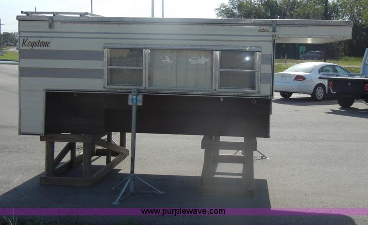 image for item D4362 1983 Keystone four wheel pop-up truck camper