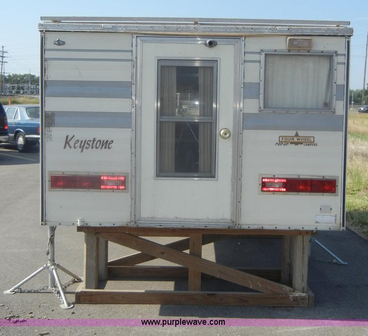 image for item D4362 1983 Keystone four wheel pop-up truck camper