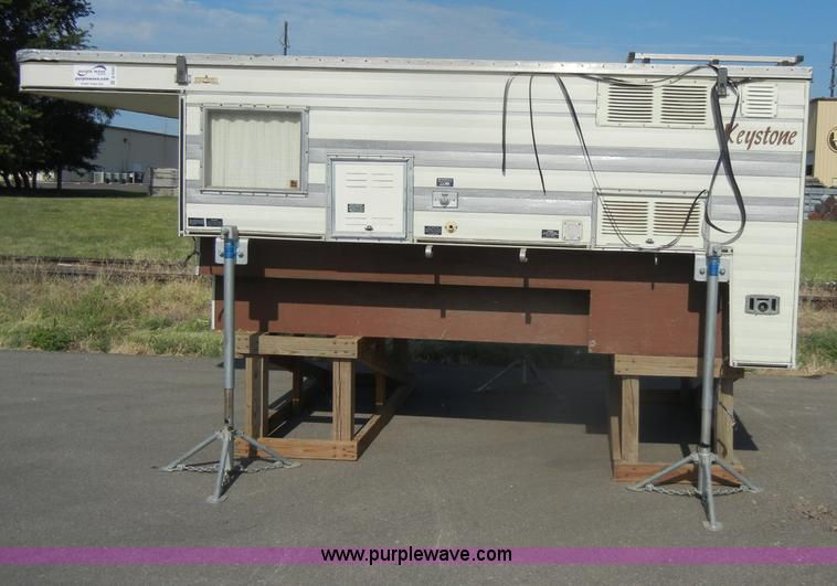 image for item D4362 1983 Keystone four wheel pop-up truck camper