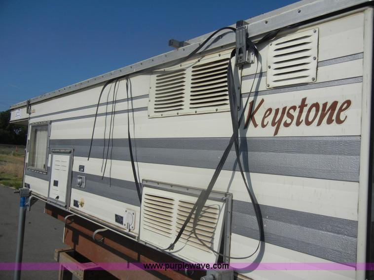 image for item D4362 1983 Keystone four wheel pop-up truck camper