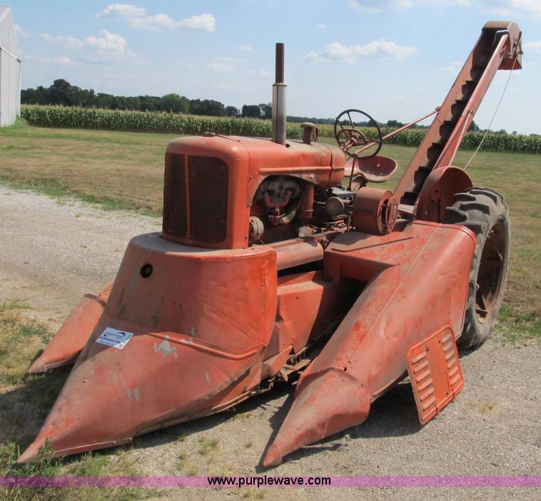 image for item B2765 1950 Allis-Chalmers WD tractor with mounted corn picker