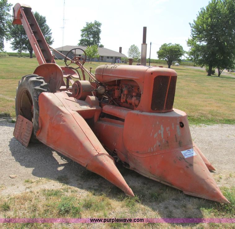 image for item B2765 1950 Allis-Chalmers WD tractor with mounted corn picker