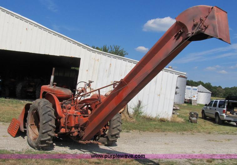 image for item B2765 1950 Allis-Chalmers WD tractor with mounted corn picker