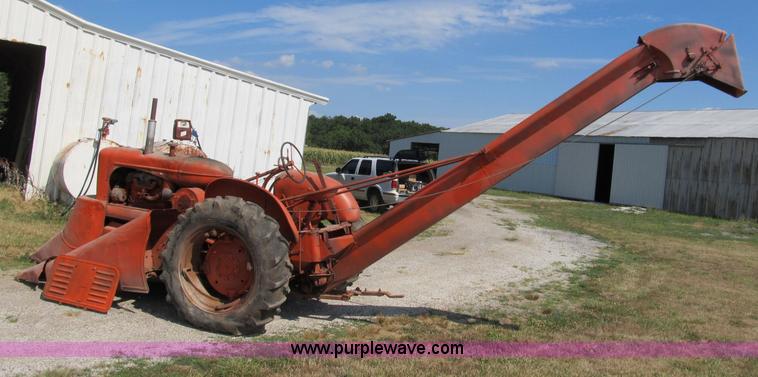 image for item B2765 1950 Allis-Chalmers WD tractor with mounted corn picker