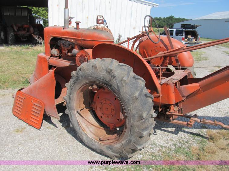 image for item B2765 1950 Allis-Chalmers WD tractor with mounted corn picker