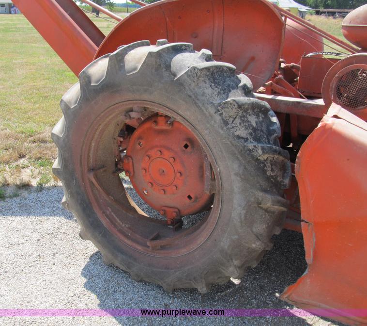image for item B2765 1950 Allis-Chalmers WD tractor with mounted corn picker